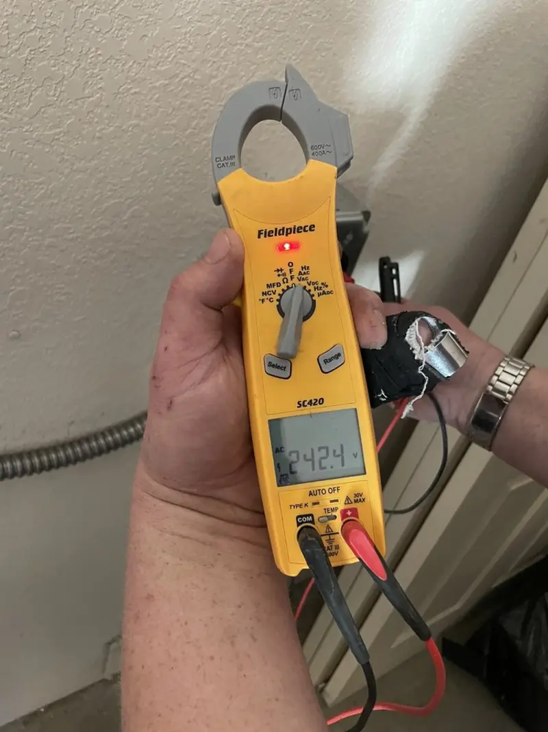Voltage testing with clamp meter during Outlet Installation in Brices Creek